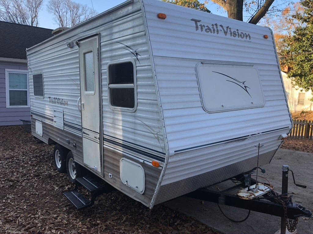 Old Trail Vision camper trailer, parked in backyard